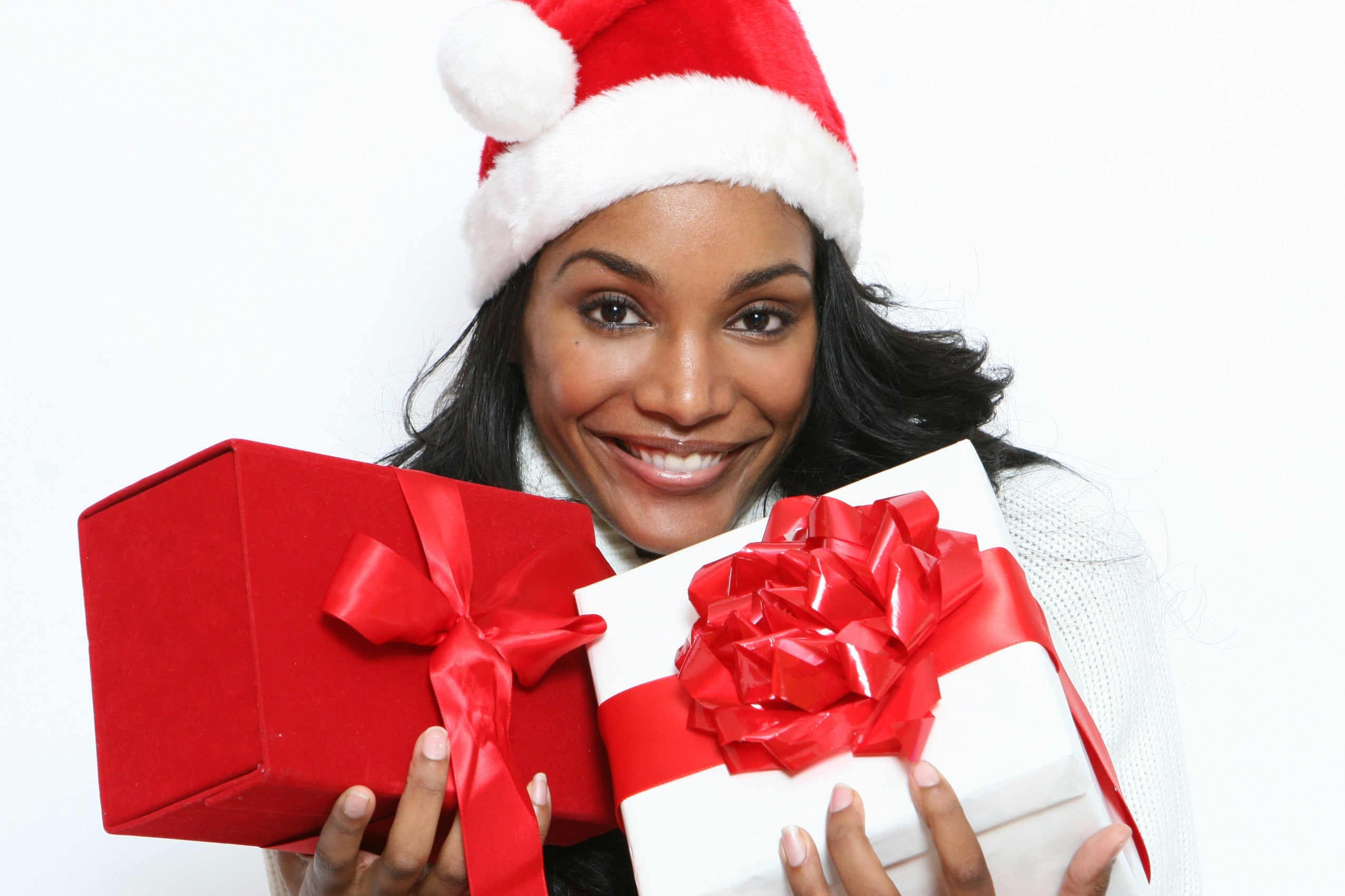 https://www.essence.com/wp-content/uploads/2011/12/images/2011/12/16/woman-with-holiday-gifts.jpg