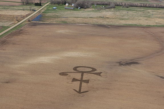 North Dakota Farmer Pays Homage to Prince by Plowing ‘Love Symbol’ into Corn Field
