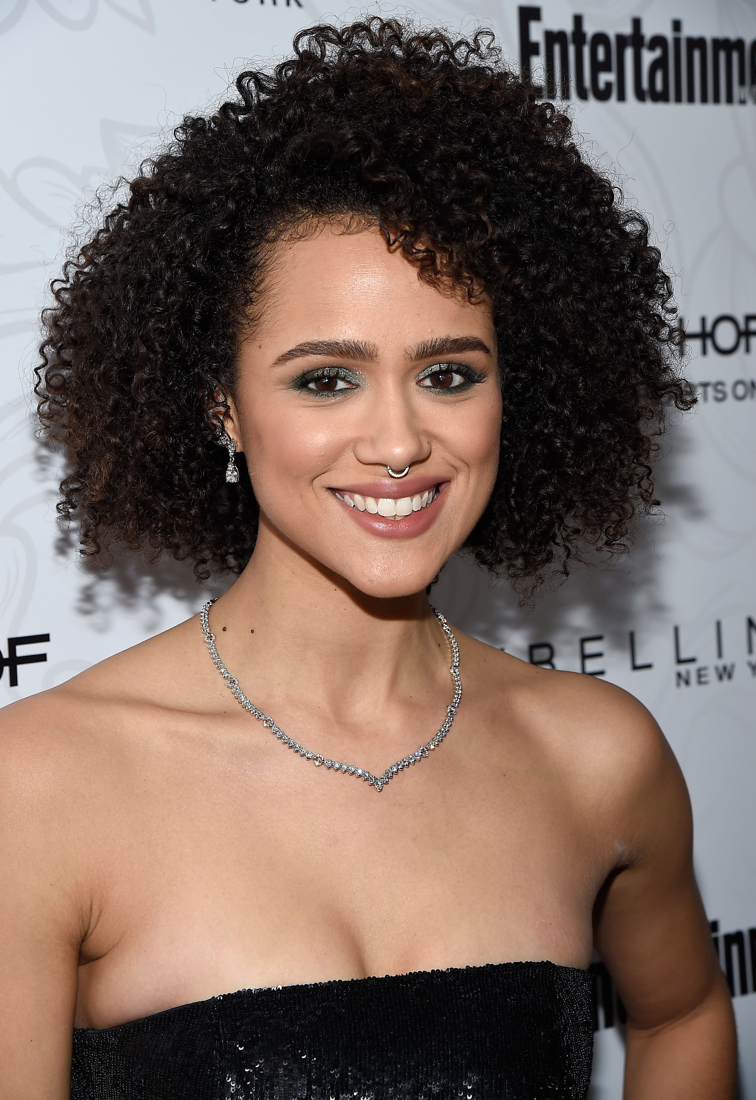 Famous celeb with black curly hair