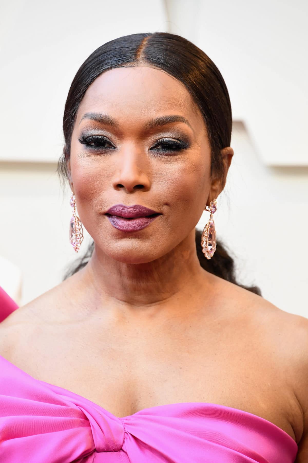 Get The Oscars Look Angela Bassett’s Pink Pout and Radiant Glow Stole