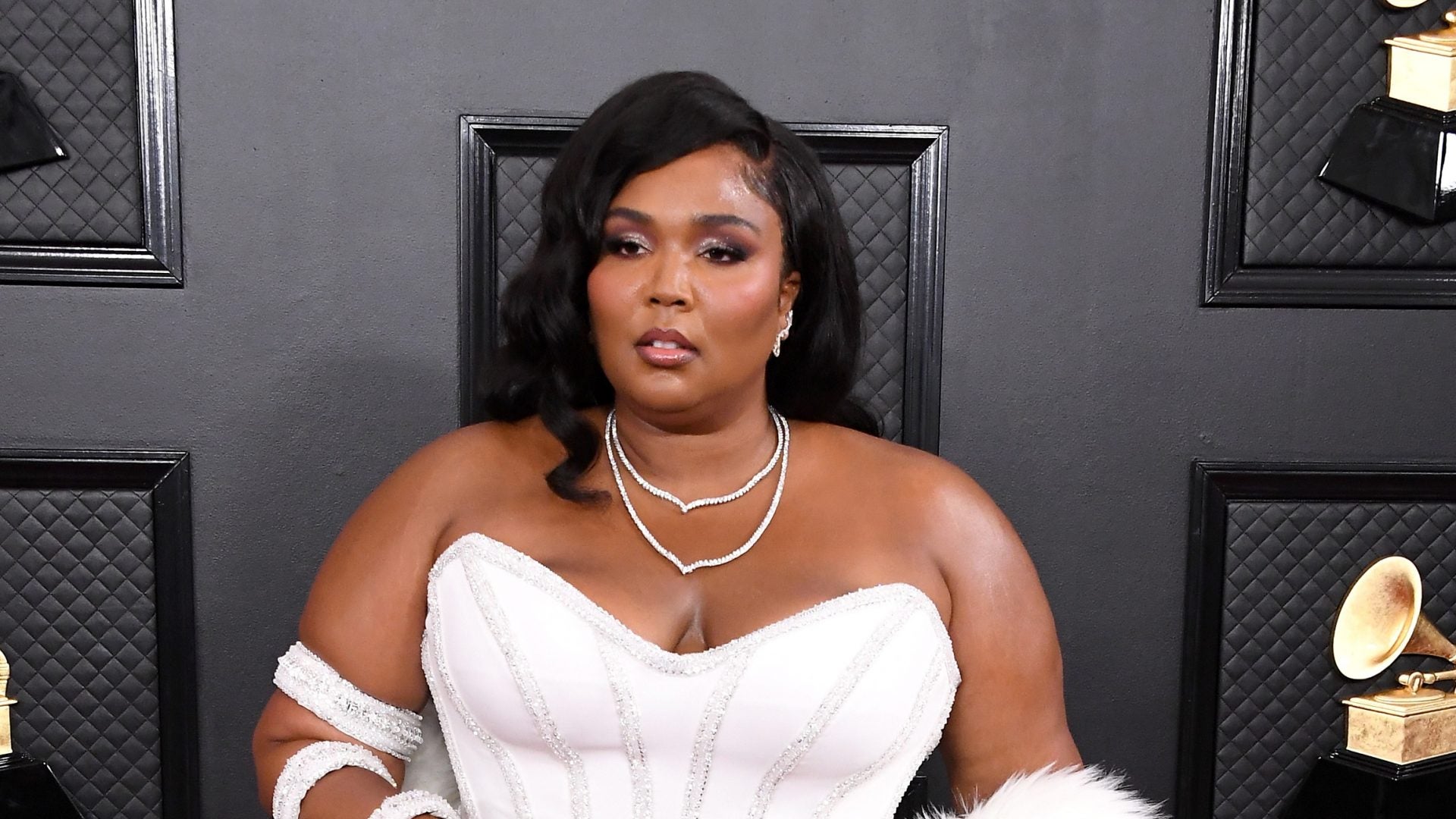 Lizzo Sports Sleek Versace Gown On The Grammy's Red Carpet