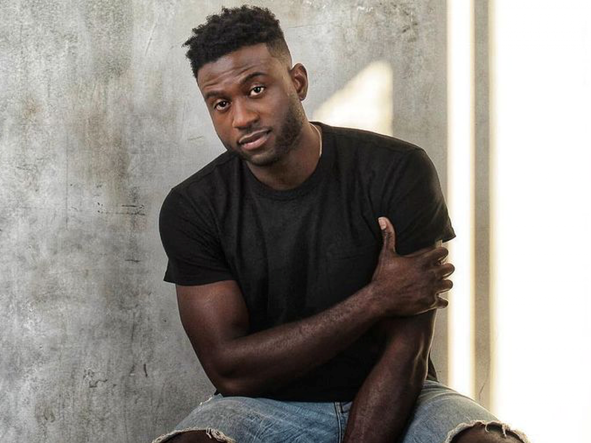 'Resort To Love' Star Sinqua Walls Talks Loving His Brown Skin | Essence