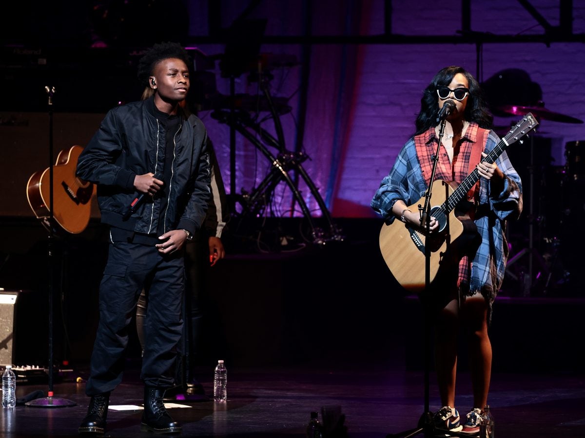 H.E.R. Headlines The Apollo After Debuting There At 9 Years Old And Brings A Young Talent With Her