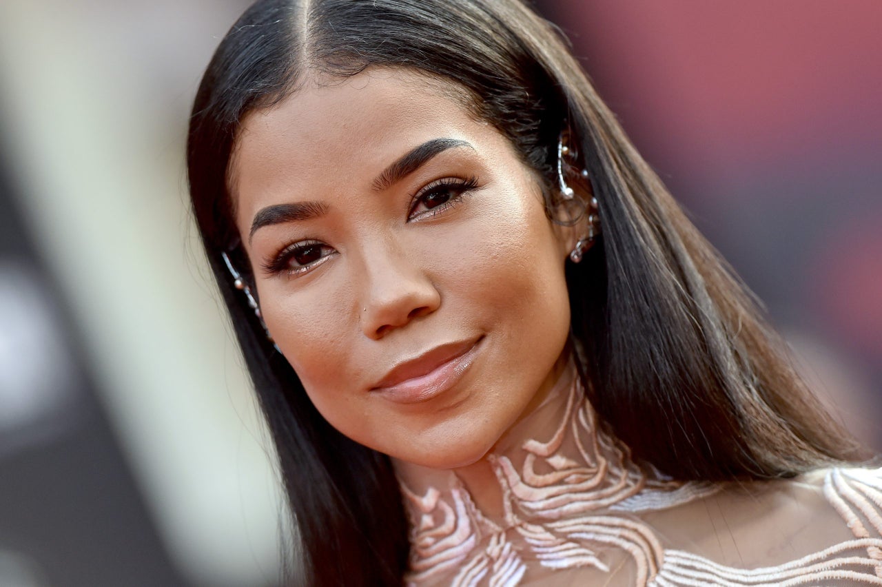 Jhené Aiko doing the sound bath with her crystal bowl along with an  instructor 