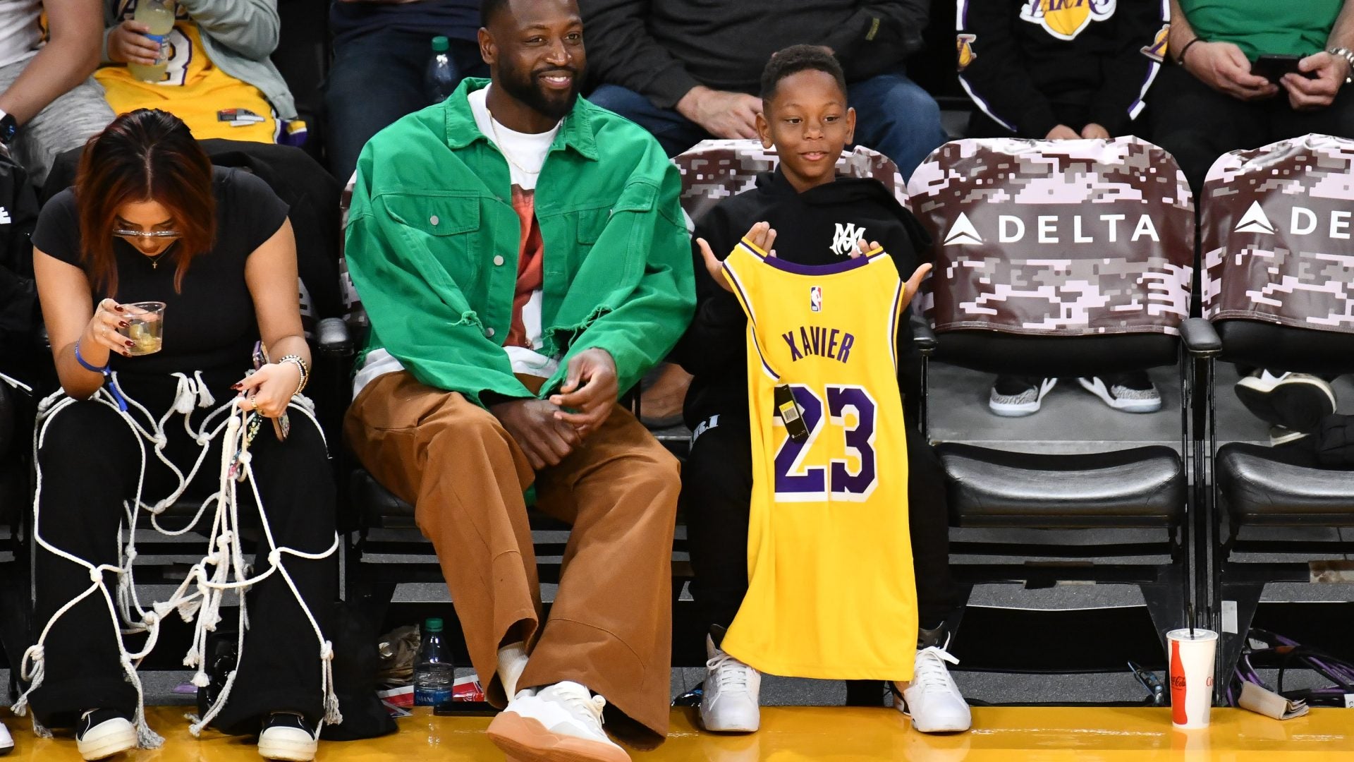 Dwyane Wade Steps Out With His Youngest Son Xavier For A Lakers Game