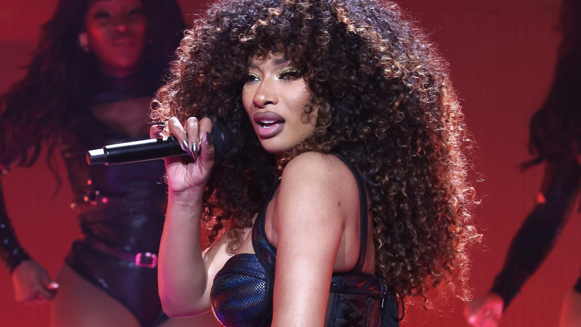 Let Meg Thee Stallion’s Voluminous Curls Inspire Your Summer Look