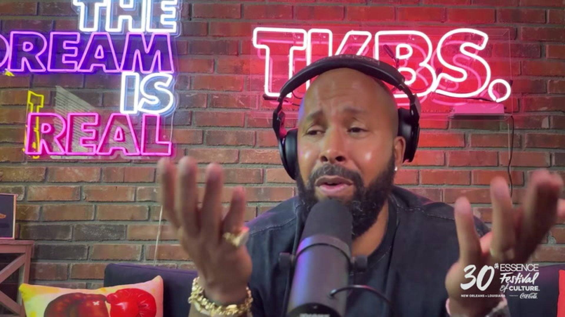 WATCH: Kenny Burns Is Excited For ESSENCE Fest 2024: “Usher’s Going To Tear A Hole In The Roof Of The Superdome”