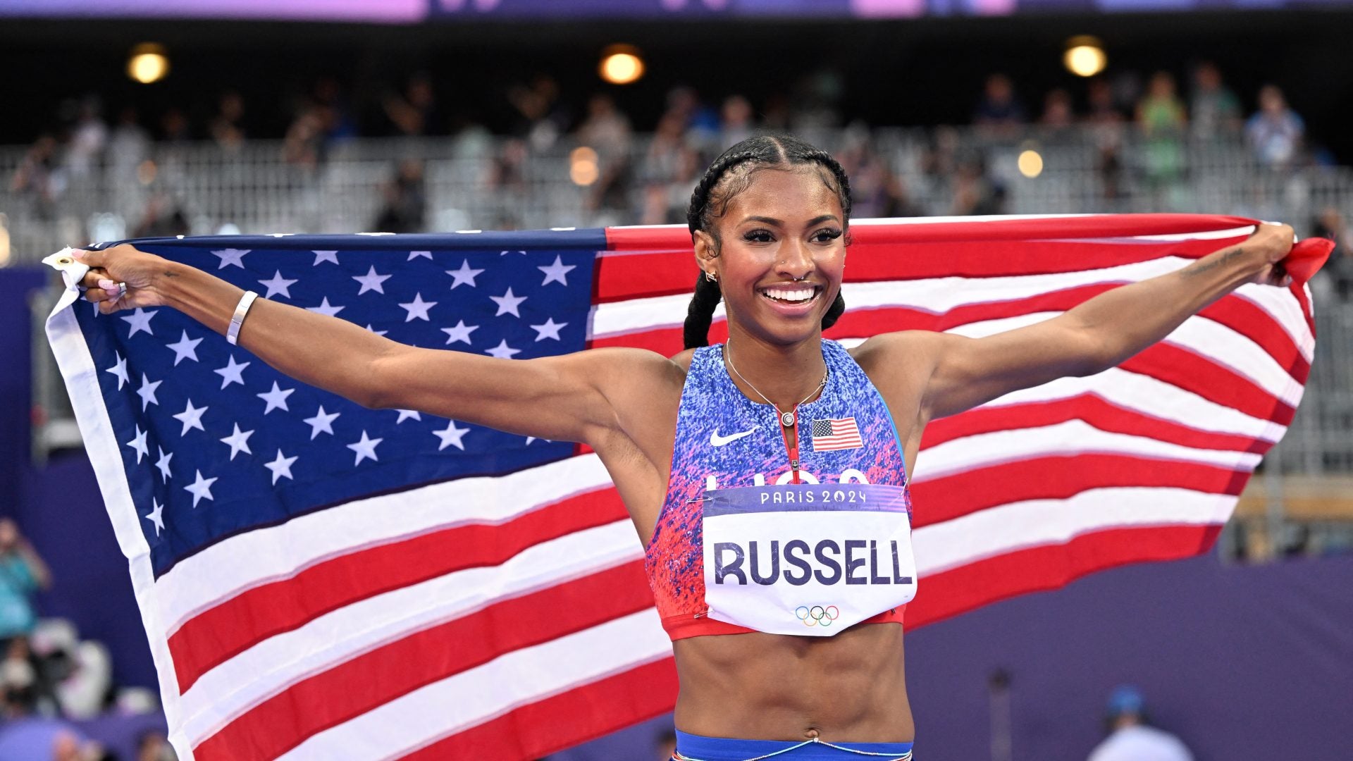 Masai Russell: An Olympic Champion Who Leaped Into The History Books