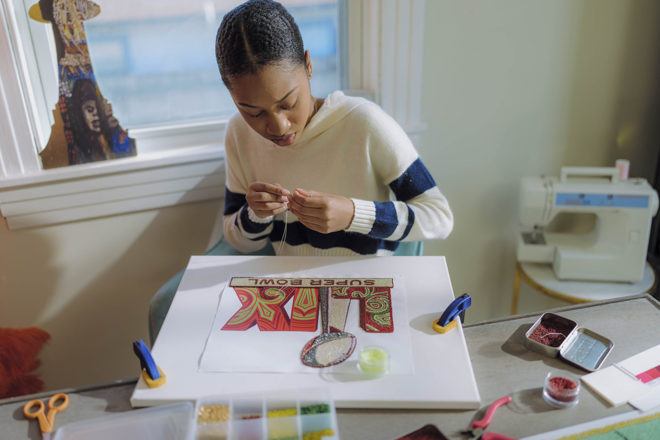 Meet 'Queen Tahj' Williams: The First Black Woman To Create The Logo And Theme Art For Super Bowl LIX